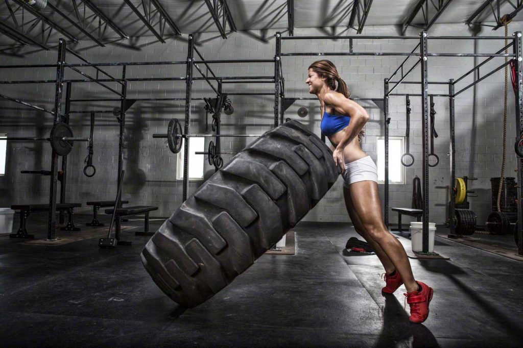 CrossFit athlete flipping a tire